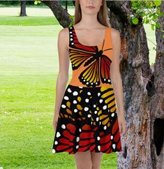 Incredible vibrantly printed dress features monarch butterfly wings. Dress to impress with this sleeveless skater dress! The soft fabric and flared skirt give it an elegant twist that brings out the intricate design with a beautiful vibrancy. The soft fabric and flared skirt give it an elegant twist that brings out the intricate design with a beautiful vibrancy. * Fabric: 82% polyester, 18% spandex * Smooth stretchy fabric which is satin smooth and matte finished. * Mid-thigh length flared skirt Spring Butterfly Print Sleeveless Dress, Sleeveless Spring Dress With Butterfly Print, Casual Sleeveless Butterfly Print Dresses, Sleeveless Butterfly Print Beach Dress, Sleeveless Black Dress With Butterfly Print, Black Sleeveless Dress With Butterfly Print, Multicolor Butterfly Print Summer Dress, Sleeveless Butterfly Print Dress For Vacation, Summer Butterfly Print Multicolor Dresses