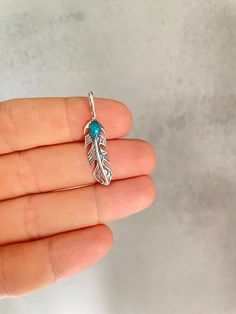 "Materials: Sterling Silver 925, turquoise Feather pendant with turquoise, Sterling Silver Feather Necklace, Feather Jewelry Silver feather Angel Feather Necklace Angel jewelry The pendant comes without chain. If you need a chain, you can purchase it separately by selecting the size. We have two kinds of chains: Snake chain 16 \"18\" 20 \" 24\" Chain in the form of rings 18 \" www.etsy.com/shop/HandmadeNordicGifts?section_id=32386755" Turquoise Feather Jewelry As A Gift, Turquoise Feather Jewelry As Gift, Silver Feather Necklace, Angel Feather, Angel Feathers, Angel Jewelry, Feather Necklace, Feather Jewelry, Feather Pendant