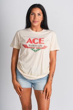 Vintage Ace Hardware tee from Lush Fashion Lounge women's boutique in Oklahoma City. Lush boutique in OKC has a variety of cute vintage t-shirts and more! This trendy vintage Ace Hardware tee is a must have! Model is 5'7 size 27 wearing size small. 100% cotton Officially licensed. Vintage T-shirt For Spring Streetwear, Cream Vintage T-shirt With Relaxed Fit, Vintage Cream Short Sleeve T-shirt, Retro Cream Short Sleeve T-shirt, Vintage Style T-shirt For Spring Streetwear, Retro Cream Cotton Top, Retro Cream Cotton Tops, Cream Soft-washed Short Sleeve T-shirt, Cream Cotton Retro Top