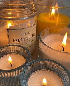 three candles sitting next to each other on a table