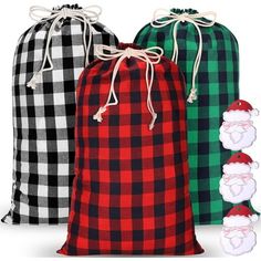 three bags with santa claus on them, one is green and the other is red