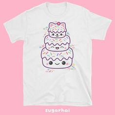 Super kawaii t-shirts featuring a pink and white cake with rainbow sprinkles and kitty cat ears.Perfect for people who love cats and cake.Comes in black or white.    100% ring-spun cotton Heavy cotton but still softThis heavy cotton shirt looks great on both men and women. Runs large for women, order your regular size for an oversized look.Fits men true to size. Sizing tip: Take a tee that fits you the way you like, lay it flat and measure the width (from under one arm to under the other arm) an White Kawaii T-shirt With Cat Print, Cute Funny Print T-shirt, Kawaii Pink T-shirt With Cat Design, Kawaii Pink Cat Design T-shirt, White Kawaii Hello Kitty T-shirt, Pink Kawaii T-shirt With Cat Design, White Cake With Rainbow, Kawaii Clothes Pastel, Cake With Rainbow Sprinkles