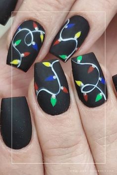 Elevate your holiday look with these 40+ stunning black Christmas nail designs! Whether you prefer long or short nails, acrylic or gel, we've got creative ideas for every nail shape. Get inspired with these amazing nail art designs featuring shades of white, red, gold, green, and silver. From cute and simple to bold and intricate, we've got everything you need to complete your winter look. Don't miss out on these amazing ideas and get ready to show off your stunning black Christmas nail designs. Black Christmas Nail Designs, Black Christmas Nails, Winter Christmas Nails, Amazing Nail Art Designs, Amazing Nail Art, Light Nails, Cute Christmas Nails