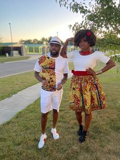 Our Dashiki African Print skirts are made from 100% quality African wax print uniquely tailored with waist lines and pleats that flatters. The skirt has a velvet fabric waist band and a zip at the opening. The male shirt is a Tshirt with an African print appliqué. Eliba Couple set can be worn for Engagement, Engagement pictures, Pre Wedding pictures, Engagement Outfit, Couple party outfit, Matching Couple Tees, Christmas pictures and Wedding pictures and many others. - match with tank tops and f White Cotton Matching Outfits Set, White Cotton Matching Outfit Sets, Matching Fitted Sets With Short Sleeves, Wedding Couple Pictures, Engaged Shirts, Couple Tees, African Print Skirt, Matching Couple Shirts, African Wax Print