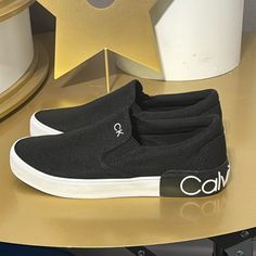 New Authentic Calvin Klein Men’s Signature Black Canvas Slip On Sneakers Sz 7 Display No Box Right Top Rim Has A Small Yellow Mark Calvin Klein Black Sneakers, Calvin Klein Shoes, Signature Canvas, Calvin Klein Men, On Sneakers, S Signature, Calvin Klein Black, Black Canvas, Slip On Sneakers