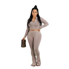 Elevate your style with our FZ Women's Tracksuit Baddie 2 Piece Pants Suit. Designed to be cute and sexy, this tracksuit will not only make a statement, but also provide comfort and flexibility. Its versatile design allows you to effortlessly transition from a casual day look to a chic evening outfit. Upgrade your wardrobe with this must-have piece. Decoration: Hooded Style: sporty Material: Polyester Season: Autumn/Winter Elasticity: Slight Stretch Fabric Type: Knitted Pattern Type: Solid Fit Type: Slim Fit Clothing Length: Short Pant Length(cm): Full Length Fabric content: 91% (inclusive) - 95% (inclusive) Collar: Hooded Waist: High Waist Closure Type: zipper Sleeve Style: Regular Material Composition: Synthetic fiber Pant Style: Flare Pants Front Style: Flat Pant Closure Type: Elastic W Tracksuit Baddie, Two Piece Set Pants, Evening Outfits, Tracksuit Women, Women Sleeve, Cropped Jacket, Slim Pants, Two Piece Set, Fall Winter Outfits