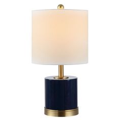 a blue table lamp with a white shade on the top and gold trim around the base