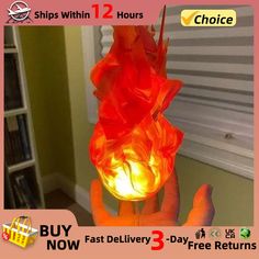 a person is holding up a lamp that looks like it has flames on it and the words, buy now fast delivery 3 - day free returns