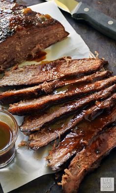 barbecue ribs and sauce on a cutting board