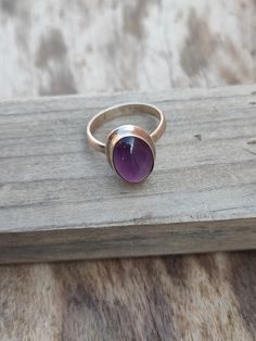 NOTE : WE USED NATURAL GEMSTONES , SO STONE MAY BE LITTLE DIFFERENT .This is a listing of Boho sterling silver ring # metal = sterling silver 925 # Gemstone - Amethyst # Ring Size - Available in all Size # Stone Color - Purple # Stone Shape - Oval Handmade Crafting bohemian Ring - This style has bohemian style . it will look beautiful when you wear it .. Thanks for visiting our shop ... favorite our shop for daily updates ... Bohemian Silver Amethyst Ring, Bohemian Amethyst Ring As Gift, Bohemian Amethyst Ring, Bohemian Sterling Silver Ruby Ring, Handmade Bohemian Amethyst Ring In Sterling Silver, Handmade Oval Amethyst Spiritual Ring, Bohemian Amethyst Ring With Natural Stones, Handmade Spiritual Oval Amethyst Ring, Purple Gemstone Bohemian Rings