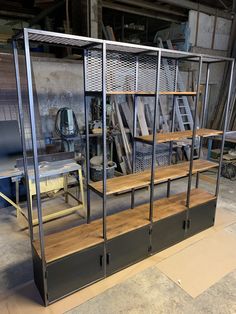 a room filled with lots of metal and wooden shelves