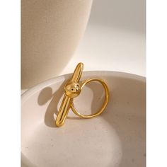 This geometric minimalist open ring is a versatile and stylish addition to any jewelry collection. Its sleek, modern design features clean lines and a minimalist aesthetic, perfect for those who appreciate simplicity and elegance. - Color: Gold- Material: Stainless Steel- Style: Ring- Pattern Type: Geometric- Size: Adjustable Opening- Gender: Women- Occasion: Casual, Formal, Wedding Open Ring Gold, Ring Pattern, Minimalist Aesthetic, Open Ring, Formal Wedding, Gold Material, Clean Lines, Design Features, Jewelry Collection