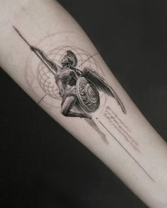 a woman's arm with a tattoo on it and an arrow in the middle