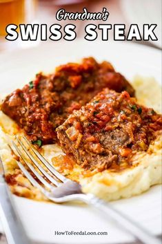 a white plate topped with mashed potatoes covered in meat and sauce next to a fork