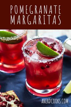 pomegranate margaritas with lime and garnish in glasses on a table