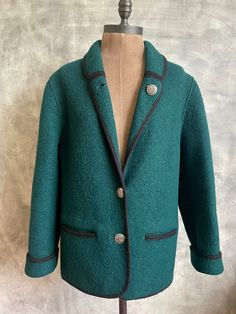 Green vintage women's jacket Black accented lapels and decorative metal buttons, with pockets. Without lining, slightly waisted Giesswein Made in Austria Schoeller  Pure New Wool Jacket is in Good Vintage condition, just normal wear and fading Chest /Pit to Pit/ 19" inches Length- 28 inches Sleeve length 21,5" inches Please view All of the pictures.  They will serve as the best description as to over all condition. International orders will be sent with priority, delivery usually 6-12 working days Decorative Metal, Green Vintage, Green Wool, Black Accents, Wool Cardigan, Vintage Wool, Wool Jacket, Green Jacket, Metal Buttons