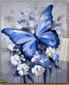 a blue butterfly sitting on top of white flowers