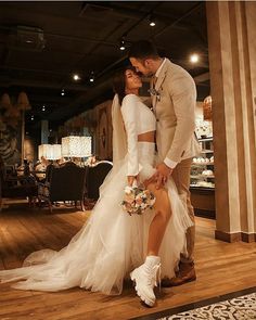 a bride and groom are posing for a photo