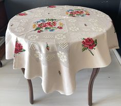 a table with a flowered cloth on it