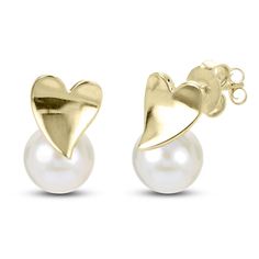 Lustrous freshwater cultured pearls are embellished by striking high-polish heart posts in these playful women's earrings. Fashioned in 14K yellow gold, the earrings secure in place with friction backs. Gold Pearl Earrings For Anniversary On Valentine's Day, Valentine's Day Pearl Earrings For Anniversary, Elegant White 14k Gold Heart Earrings, Pearl Earrings For Valentine's Day Anniversary, Heart Shaped Pearl Earrings For Formal Occasions, Pearl Drop Heart Earrings For Valentine's Day Anniversary, Valentine's Day Gold Pearl Earrings For Anniversary, White 14k Gold Earrings For Valentine's Day, Valentine's Day Pearl Drop Heart Earrings For Anniversary