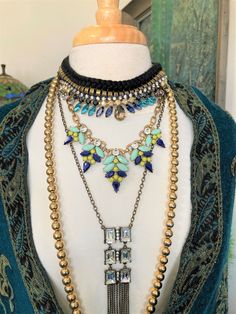 4/Layered Necklaces/Rhinestones/Tribal Ish/Boho Necklace/ Iris Apfel / Neck Mess /Curated by Potion Four necklaces from a long brass strand to a tribal-ish collar of 16 inches. Acrylic, brass, cotton, crystal, and glass. 16 to 30". See our other necklace collections here: https://www.etsy.com/shop/BrickCity?section_id=18315960 Note: TRBL in down chst inv Bohemian Gold Bling Jewelry, Bohemian Multi-strand Jewelry For Parties, Bohemian Rhinestone Necklace For Festivals, Bohemian Rhinestone Jewels Necklace For Party, Bohemian Rhinestone Jewelry For Gifts, Gold Rhinestone Necklaces For Festival, Bohemian Rhinestone Party Necklace, Bohemian Rhinestone Party Jewelry, Bohemian Bling Jewelry For Party