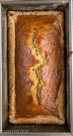 a loaf of zucchini bread sitting in a pan on top of a counter