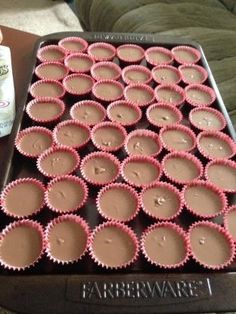 there are many cupcakes in the pan ready to be eaten and served on the table