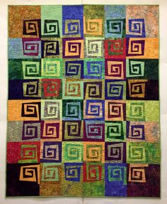 a colorful quilt with squares on it