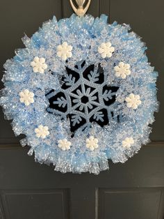 Handmade Snowflake Christmas wreath Color - Blue deco mesh with in bit of fake snow on the mesh. I added styrofoam snowflakes, clear plastic snowflakes ornaments and blue snowflake in the center of the wreath.   This beautiful wreath will look great on your front door with your Christmas decoration. You can also hang it inside in any room with your Christmas decor. Highly recommend to bring the wreath inside from rough weather conditions, wind, rainstorms, snow.  Size - 20"L x 14" W Shipping is Snow Flake Wreaths, Snowflake Deco Mesh Wreath, Snowflake Wreaths, Winter Wreath Snowflake, Christmas Snowflakes Wreath, Blue Snowflake Wreath, Snowflakes Ornaments, Wreath Inside, Snowflake Wreath