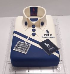 a polo shirt cake is on display for people to see