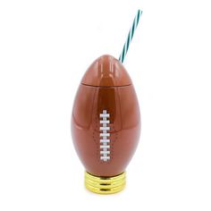 an egg shaped drink dispenser with a football on it and a straw