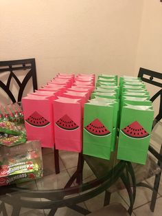 watermelon bags are sitting on a glass table