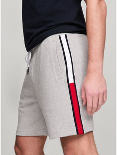 Tommy Hilfiger men's short. For days off or lounging around, reach for these cozy sweatshorts made from French terry cotton and printed with our signature flag stripe along the leg.  Material: 100% Cotton. Cotton Athletic Shorts With Three Stripes, Casual Cotton Athletic Shorts With Three Stripes, Casual Athletic Shorts With Side Stripes, Casual Cotton Bottoms With Signature Stripes, Cotton Athleisure Shorts With Three Stripes Branding, Sporty Tommy Hilfiger Short Bottoms, Tommy Hilfiger Sporty Shorts, Cotton Shorts With Side Stripes, Casual Cotton Shorts With Side Stripes