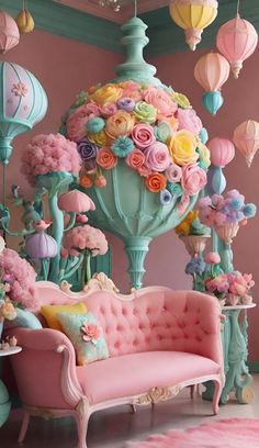 a room filled with lots of pink furniture and flowers on top of the couches