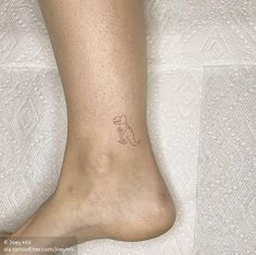 a person with a small tattoo on their foot