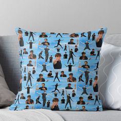 a blue throw pillow with many images of people in different poses and sizes on it