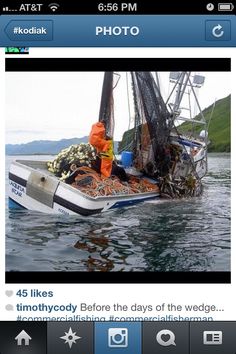 an image of a boat in the water with people on it's front end