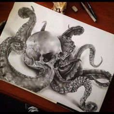 an octopus and skull drawing on paper