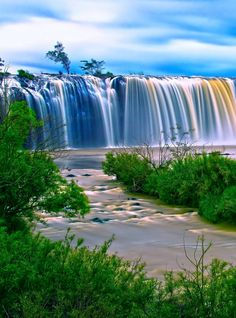 an image of a waterfall that is in the water