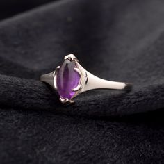 Dive into the magical temptation of this stunning Ring in attractive shape and design made of Sterling Silver studded with Amethyst. An essential ornament to add in your jewelry collection! ----------------------------------- Welcome TO Our Shop TJONILNESHOP ----------------------------------- Dainty Amethyst Ring, Unique Gemstone Ring, Sparkling Purple Ring, 925 Sterling Silver Ring, Handmade Jewelry For Women, Cocktail Ring Idea SKU : TR-2-7 Gemstone : Amethyst Stone Shape : Marquise Metal : S Mystical Gemstone Rings For Formal Occasions, Mystical Sterling Silver Open Ring, Mystical Sterling Silver Promise Ring, Sterling Silver Marquise Birthstone Ring For Gift, Mystical Sterling Silver Birthstone Rings, Marquise Amethyst Ring Gemstone Gift, Fine Jewelry Amethyst Ring With Polished Finish As Gift, Gift Marquise Amethyst Ring, Marquise Amethyst Ring Gift