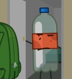 a green backpack with a face drawn on it next to a water bottle that is stuck in the wall