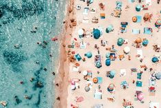 an aerial view of people relaxing on the beach