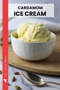 a white bowl filled with ice cream on top of a wooden cutting board