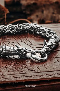 Vikings used jewelry with animals or beasts. This variant consists of a King Chain bracelet that ends in the heads of Freki and Geri, the two wolves of Odin. As the name implies, the king chain weave was seen as a sign of success and power among the Vikings.  #grimfrost Viking Style Silver Metal Bracelet, Silver Viking Bracelet Engraved, Viking Style Metal Bracelet For Gift, Handmade Viking Style Bracelet, Viking Style Bracelet Jewelry Gift, Handmade Viking Style Metal Jewelry, Viking Style Metal Bracelet Jewelry, Gothic Chain Bracelet, Gothic Chain Bracelet Jewelry