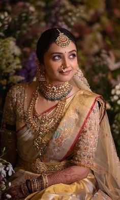 a woman in a bridal outfit sitting down