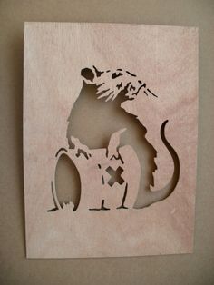 a wooden cutout of a cat and dog