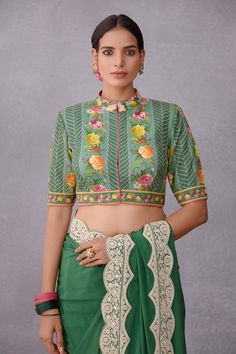 Emerald green saree blouse with all-over multi-color floral print, mandarin collar and concealed placket.
Components:1
Printed
Neckline:Mandarin Collar
Sleeve Length:Half
Fabric:Pure Cotton Silk, Handwoven Chanderi
Color:Green
Note: The saree worn by the model is not for sale - Aza Fashions Indian Mythology, Saree Blouses Online, Cotton Saree Designs, Green Saree, Indian Textiles, Blouse For Women, Saree With Blouse, Silk Crepe, Green Fabric