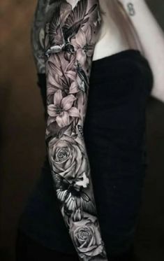 a woman with black and white tattoos on her arm