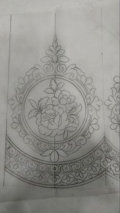 an intricately designed piece of paper with flowers on it