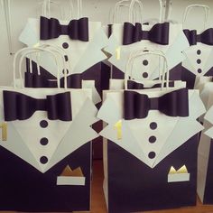 black and white paper bags with bow ties on them